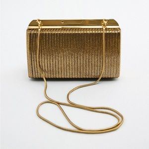 Gold clutch with removable gold strap